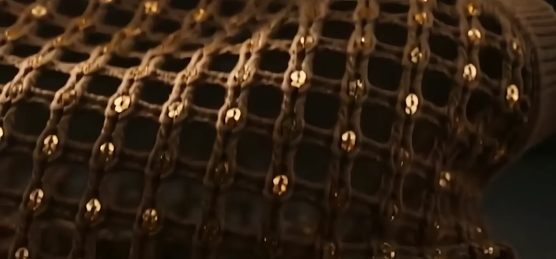 A close view of intricate natural-fibre knitwear and sequin embellishments.